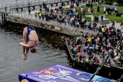 Molly Carlson of Canada dives from the 21m platform during the final competition day of the first stop of the Red Bull Cliff Diving World Series in Boston, USA, on June 3, 2023. 