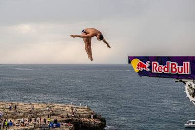 Aidan Heslop of the UK dives from the 27.5 metre platform during the first competition day of the third stop of the Red Bull Cliff Diving World Series in Polignano a Mare, Italy on July 1, 2023.