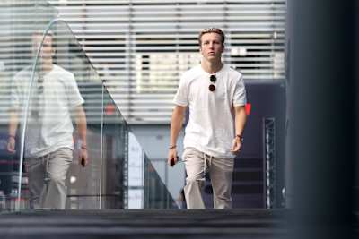 Liam Lawson of New Zealand and Scuderia AlphaTauri walks in the Paddock prior to practice ahead of the F1 Grand Prix of Italy at Autodromo Nazionale Monza on September 01, 2023 in Monza, Italy. 