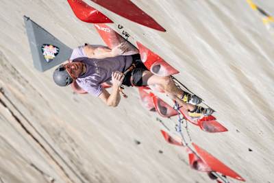 In 2024, Jakob Schubert scales the towering Red Bull climbing route at Verzasca Dam in Switzerland during an intense competition