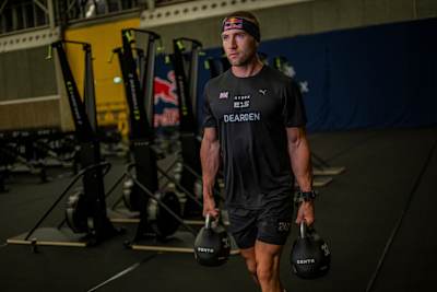 Jake suggests training six days a week, combining Hyrox-specific exercises like farmer's carries with running to get prepped for the course