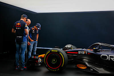 Max Verstappen and Sergio Pérez look at the RB20 with Adrian Newey, Chief Technical Officer of Red Bull Racing, at Red Bull Racing Factory on February 15, 2024, in Milton Keynes, England.