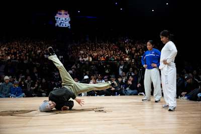 B-Girl Ami of Japan competes alongside B-Boy Taisuke against B-Girl India and B-Girl Logistx at the Red Bull Lords of the Floor at WAMU Theater in Seattle, USA, on April 6, 2024. 