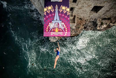 Meili Carpenter launches... spot the safety divers carefully watching below