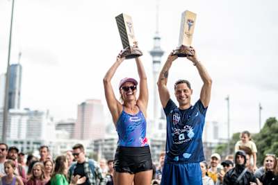 2023 World champions Rhiannan Iffland (L) of Australia and Constantin Popovici of Romania celebrate with their King Kahekili trophies .