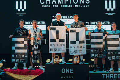 Jake Dearden and Marc Dean stand on the first place of the podium for the doubles category at the Hyrox World Championship in Nice, France, on June 9. 2024. 