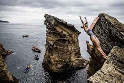 Anna Bader of Germany dives during the Red Bull Cliff Diving World Series at Sao Miguel, Azores, Portugal on July 7, 2017. 