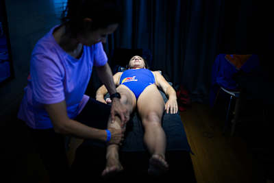 Eleanor Smart of the USA getting physiotherapy prior to the second stop of the 2024 Red Bull Cliff Diving World Series in Boston, USA on June 6, 2024.