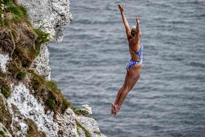 Rhiannan Iffland dives gracefully from Kinbane Castle cliff during Red Bull Cliff Diving World Series event