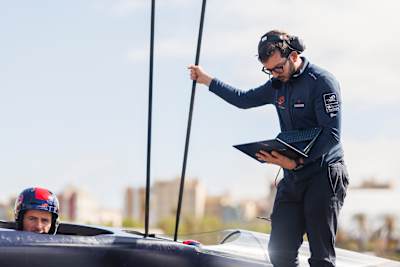 Maxime Bachelin (L) and Simeone Busonero (R) of Alinghi Red Bull Racing seen prior to the first towing test of BoatOne in Barcelona, Spain on April 17, 2024.
