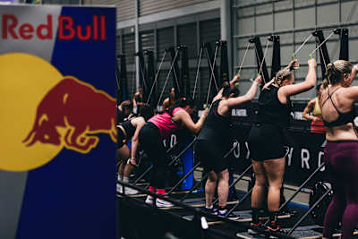 Hyrox competitors use the ski ergs next to the Red Bull hydration station at Hyrox's Sydney event on July 27, 2024.