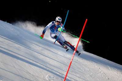 In the 2023-2024 season, Henrik Kristoffersen carves through snow during Red Bull's Hahnenkamm race in Kitzbühel, Austria