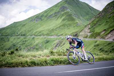 On July 10th 2024, Primož Roglič climbs Puy Mary for Red Bull BORA - hansgrohe during stage 11 of the Tour de France, showcasing elite cycling against France’s iconic mountain backdrops.
