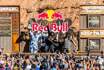 Robin Goomes, Hannah Bergemann and Georgia Astle celebrate on the podium at Red Bull Rampage 2025