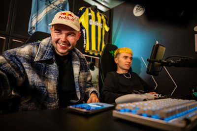 Damian 'PLKD' Kornienko attends the FC 26 Launch Event in London, UK, on September 17, 2025, surrounded by gaming tech and iconic football shirts.
