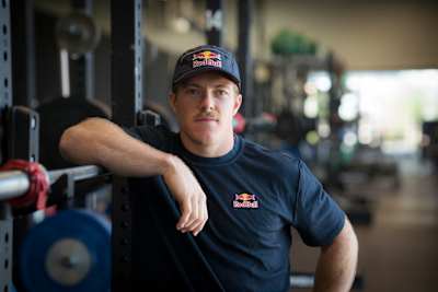 Noah Ohlsen sporting Red Bull gear poses in a Mesa, Arizona gym during the World Fitness Project Tour Stop 2 on August 29, 2025.