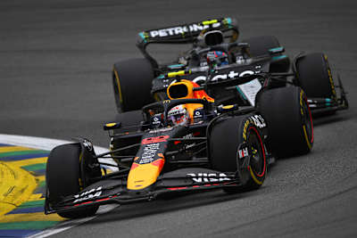 Yuki Tsunoda (Red Bull) leads ahead of Andrea Kimi Antonelli (Mercedes) on the Interlagos circuit at the 2025 Formula 1 Brazilian Grand Prix in São Paulo.