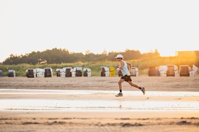 Florian Neuschwander is running during the Red Bull Wattlauf teaser production in Cuxhaven, Germany on September 05, 2024.