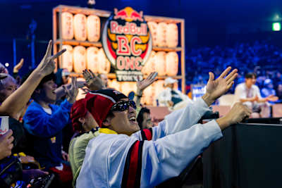 Fans throw up cheers at the Red Bull BC One World Final 2025 inside Ryogoku Kokugikan Sumo Arena, Tokyo, capturing the high energy of the event
