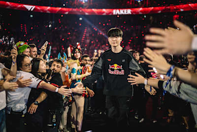 Faker of T1 makes his entrance at Red Bull League of Its Own 2025 in Munich, Germany, high-fiving the crowd within SAP Garden.