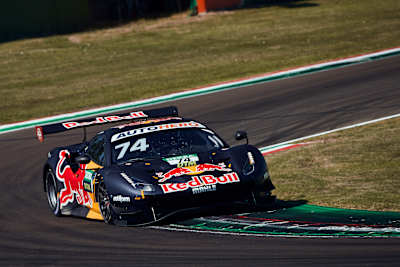Felipe Fraga navigates the Red Bull-sponsored Ferrari at the Autodromo Enzo e Dino Ferrari in Imola, Italy, during a DTM race on June 19, 2022.