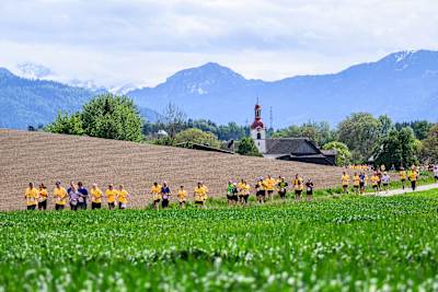Participants shine during the Wings for Life World Run in Zug, Switzerland on May 5, 2024, showcasing incredible camaraderie and determination against a scenic backdrop.
