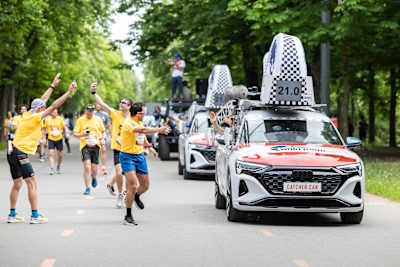 Excitement at the Wings for Life World Run in Vienna, Austria, May 2024, as runners engage with the iconic Catcher Car