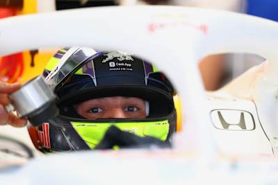 Isack Hadjar of Visa Cash App Racing Bulls is focused and ready as he prepares for the 2025 Chinese Grand Prix at the Shanghai International Circuit.