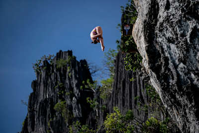 Molly Carlson of Canada executes a stunning dive from 21.5 metres during the inaugural Red Bull Cliff Diving World Series 2025 at Lagen Island, El Nido, Philippines