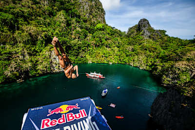Ukrainian diver Oleksiy Prygorov performs a breathtaking dive from the 28-metre platform at the majestic Big Lagoon in El Nido, during the 2025 Red Bull Cliff Diving World Series