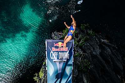 Australian athlete Rhiannan Iffland leaps from a 21-metre platform at El Nido's Big Lagoon during the stunning Red Bull Cliff Diving World Series 2025 opener