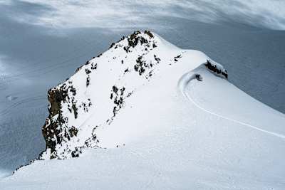 Manon Loschi slashing pow during the Red Bull Alpine Camp in Zermatt on May 17, 2024.