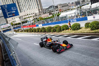 Yuki Tsunoda of Japan and Oracle Red Bull Racing and Max Verstappen of the Netherlands and Oracle Red Bull Racing drive during an Oracle Red Bull Racing Show Run on April 02, 2025 in Tokyo, Japan. 
