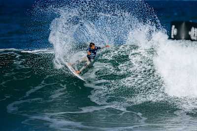 Jack Robinson carves through a wave during Heat 2 of the semi-finals at the 2025 Rip Curl Pro Bells Beach, showcasing his incredible surfing skills.