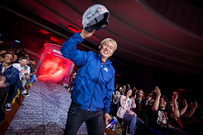 Masato 'Bonchan' Takahashi engages fans at the Red Bull Kumite World Final in Paris, France, showing his charisma and connection with the audience on April 6, 2025