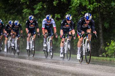 Primož Roglič rides at the front for Red Bull-BORA-hansgrohe during a rainy stage of Giro d'Italia 2025 in Flambro, Italy.