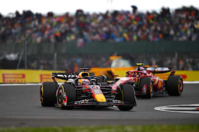 Max Verstappen driving the (1) Oracle Red Bull Racing RB20 leads Carlos Sainz during the F1 Grand Prix of Great Britain at Silverstone Circuit on July 07, 2024 in Northampton, England.