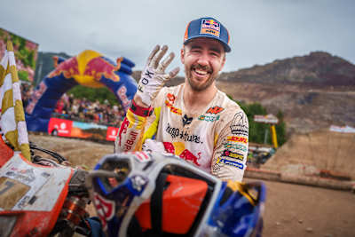 Manuel Lettenbichler celebrates his fourth Red Bull Erzbergrodeo victory in Eisenerz, Austria during June 2025, showcasing the grit and glory of extreme enduro motorcycling