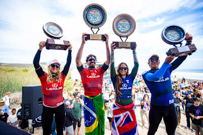 Molly Picklum, Yago Dora, Bettylou Sakura Johnson and Kanoa Igarashi proudly display trophies at the 2025 Lexus Trestles Pro in San Clemente, California.