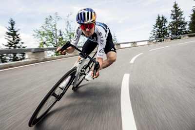 Tom Pidcock rides with exhilarating speed during on Rossfeld in the German Alps.