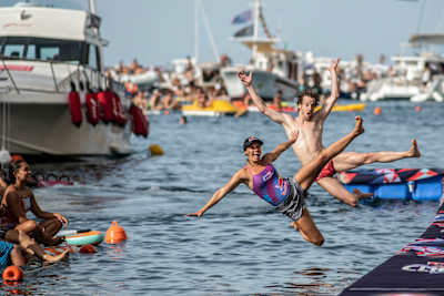 Gary Hunt and Rhiannan Iffland jump into the water to celebrate in Polignano a Mare, Italy.