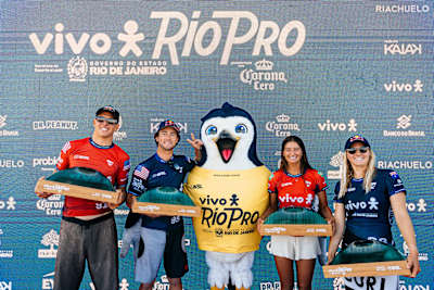 On June 29, 2025, Red Bull surf athletes Molly Picklum and Griffin Colapinto stand on the VIVO Rio Pro Saquarema podium in Brazil, showcasing their trophies.