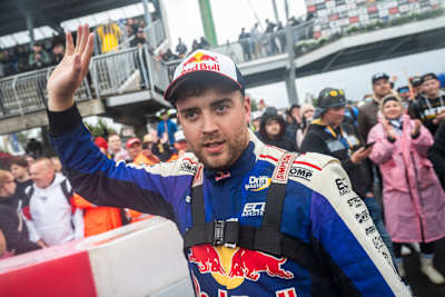 Conor Shanahan raises his hand in celebration after winning Round 3 of the Drift Masters European Championship in Alahärmä, Finland, in 2025.