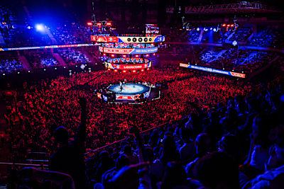A packed crowd cheers at the Red Bull Batalla World Final 2024 in Madrid, Spain, where freestyle MCs battle under vibrant lights, capturing Red Bull's legendary high-energy atmosphere
