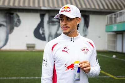 Xavi Simons of RB Leipzig holding a Red Bull can