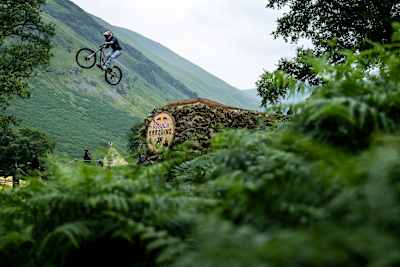 Hannah Bergemann takes on a gap jump at Red Bull Hardline in Dinas Mawddwy, Wales in July 2025. 