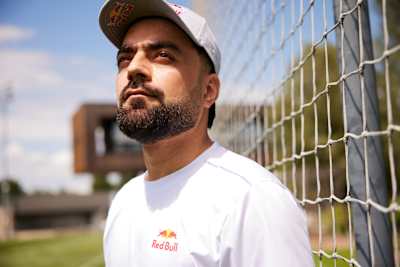 On July 23, 2025, Rashid Khan stands on the cricket pitch in Salzburg, Austria