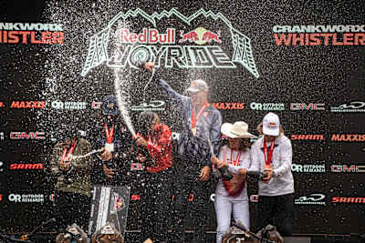 On August 17, 2025, Emil Johansson, Alma Wiggberg, Robin Goomes and fellow winners spray champagne on the Red Bull Joyride podium at Crankworx Whistler, capturing the thrill of victory