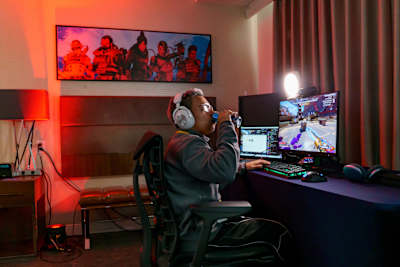 Phony sharpens his competitive edge at the Red Bull Legends Inn in Chicago, USA on November 08, 2024, surrounded by gaming gear.