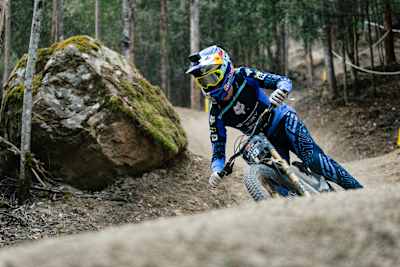 In 2025, Asa Vermette speeds through a rugged forest track during Red Bull Hardline practice at Maydena Bike Park, Tasmania, showing Red Bull's passion for extreme mountain biking.